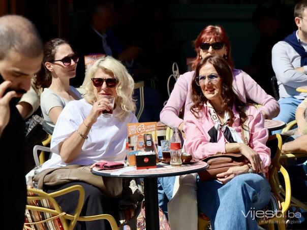 Sunny Saturday in Sarajevo, citizens enjoy the gardens of cafes