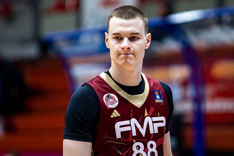 Basketball player from Serbia at the game lifted three fingers and handled it on the border with Croatia