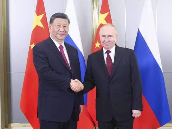 Putin: Russia and China together against sanctions that interfere with global trade