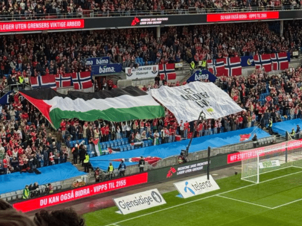 Norwegians develop a Palestinian flag during the match against Israel