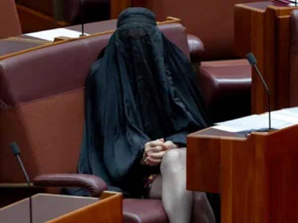 The Australian Senate suspended right-winger Pauline Hanson for wearing a burka