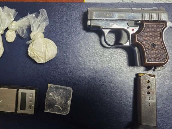 The man handed over the drugs and the gun to the police