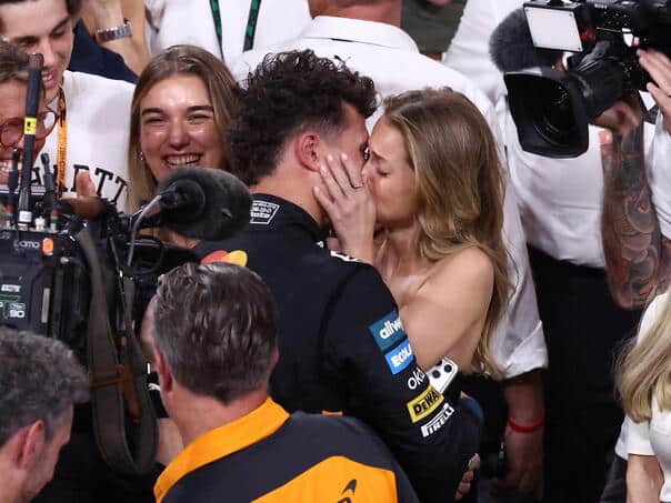 New F1 winner passionately kisses girl in front of world, fans appalled