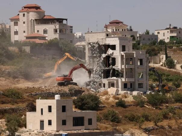 Israel began demolishing 25 buildings in the West Bank