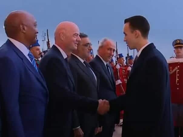 A young Moroccan prince avoids the customary hand-kissing at a formal ceremony