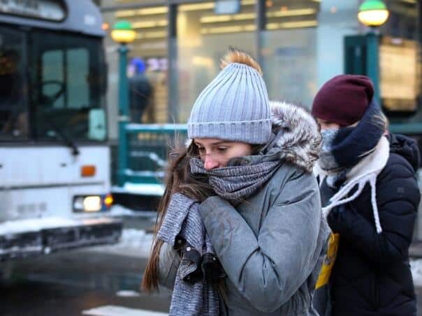 Sunny in the south, cloudy inland with possible rain and snow