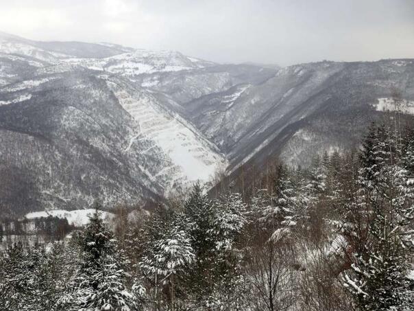 Cloudy morning, snow on higher ground