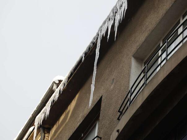 Citizens and utilities in KS report untidy sidewalks, icicles and trees