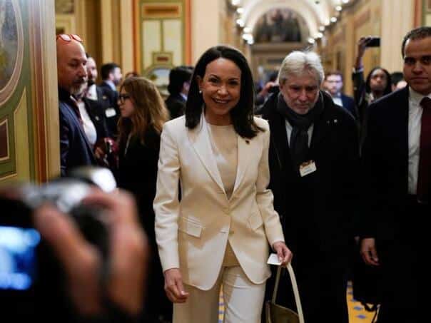 Machado was greeted with a standing ovation in front of the White House after her meeting with Trump