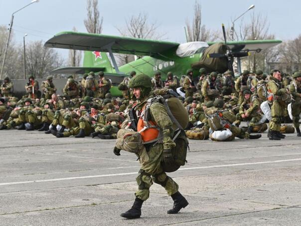 While the Kremlin sends messages of peace, Russia is amassing a force of 100,000 troops