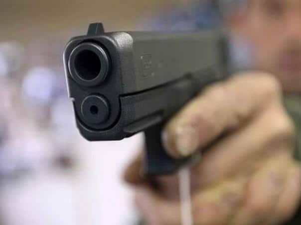 A man broke into a betting shop with a gun and robbed it
