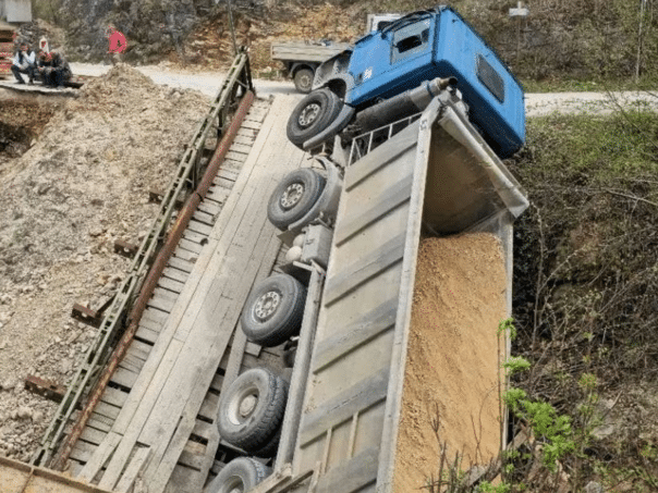 A wooden bridge in Ključ collapsed, with a vehicle on it